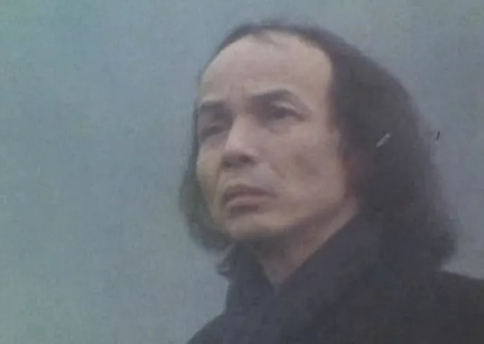 Toru Takemitsu with long dark hair on the misty film set of Kurosawa's Ran