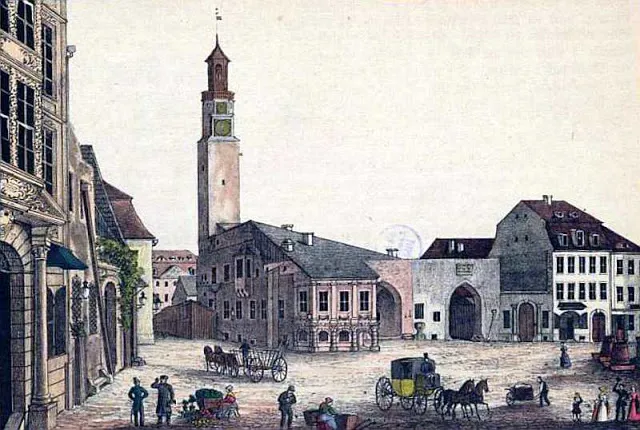 Hand-colored print of a Zittau square with a tall clock tower and horse-drawn carriages